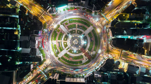 istock Aerial view beautiful pattern highway road intersection at night  for transportation, distribution or traffic background. 1058174286