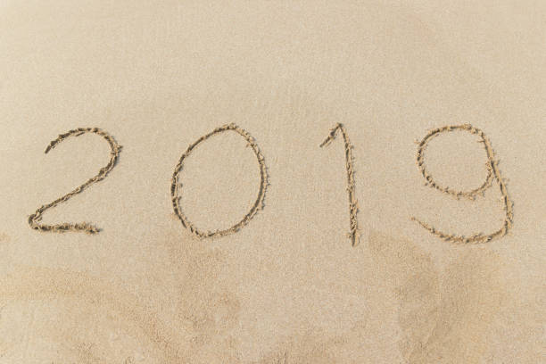 istock New Year 2019 written on sandy beach 1058174496