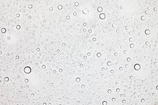 istock Rain droplets on glass background, Water drops on glass. 1058180364