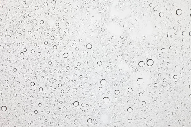 istock Rain droplets on glass background, Water drops on glass. 1058180384