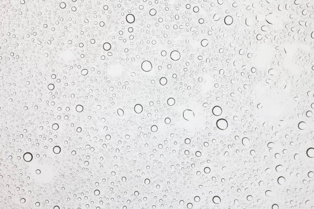 istock Rain droplets on glass background, Water drops on glass. 1058181928