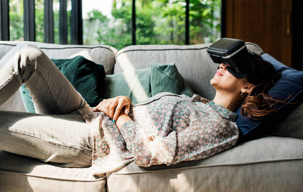 People enjoying virtual reality goggles stock photo