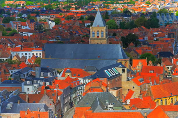 istock Above Bruges rooftops and gothic cathedral with bell tower - medieval old town - Belgium 1058195844
