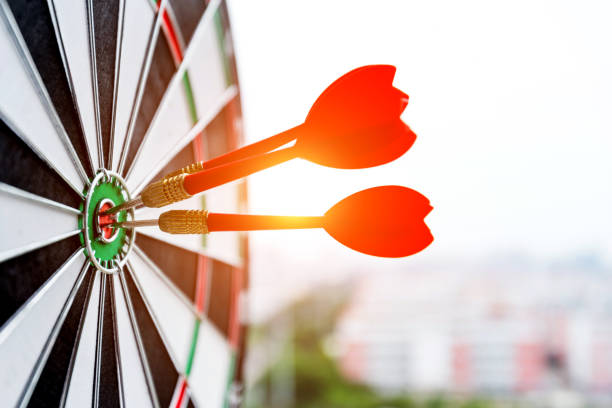 istock Dart board with three darts outdoors 1058196006