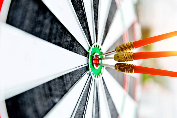 Dart board with three darts outdoors