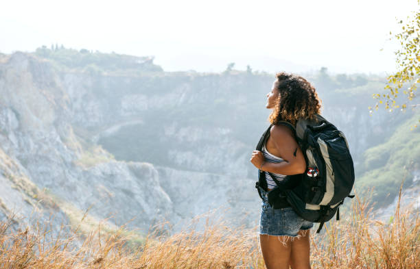 istock Woman traveler looking at mountain 1058198310