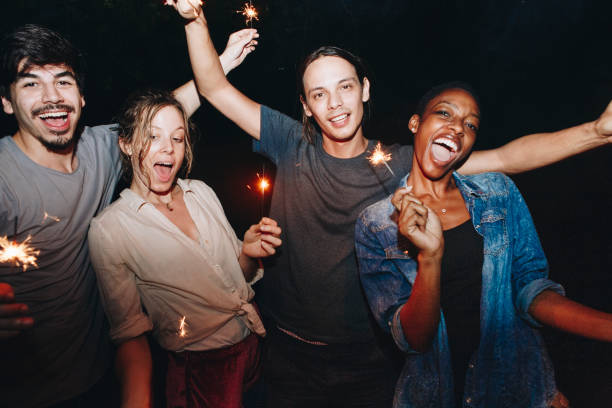 istock Friends celebrating with sparklers in the night 1058199474