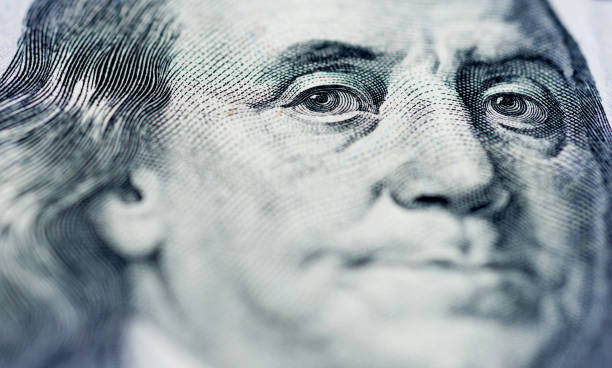 istock Portrait of Benjamin Franklin on one hundred dollar bill 1058201242