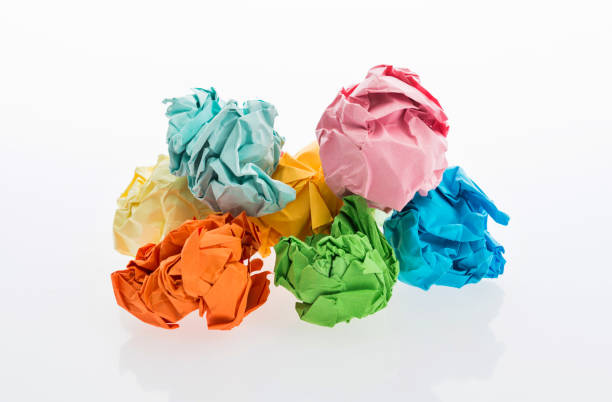 istock Colorful crumpled paper balls on white background 1058203022