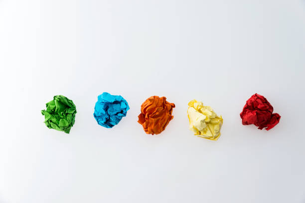 istock Colorful crumpled paper balls on white background 1058203056
