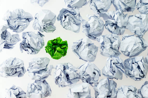 istock Green and white paper balls 1058203180