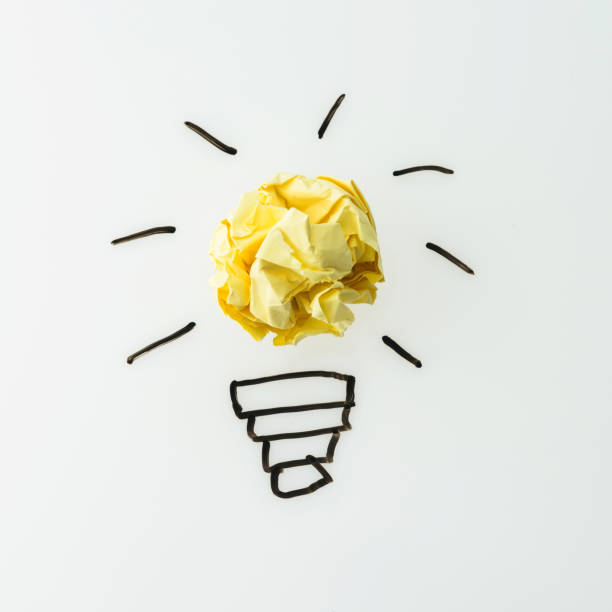 istock Yellow crumpled paper light bulb 1058203278
