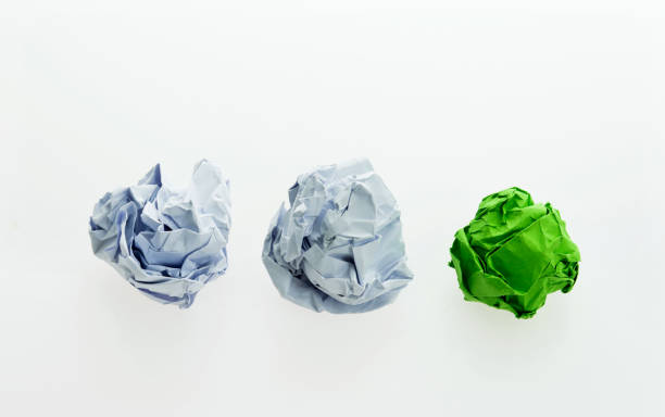 istock Green and white paper balls 1058203286