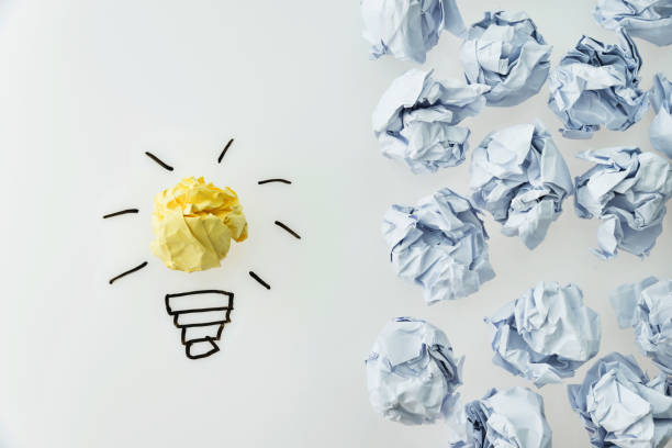 Yellow crumpled paper light bulb stand out.