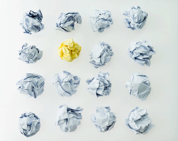 istock Yellow and white paper balls 1058203464
