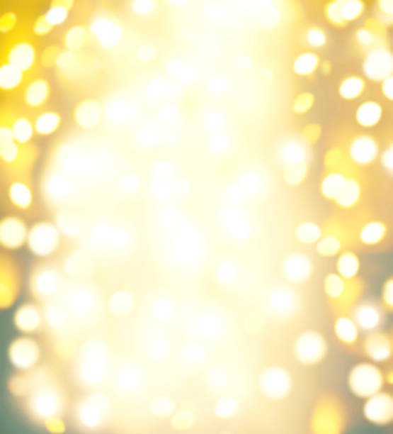 istock Abstract Golden Christmas Winter Background with sparkling bokeh lights 1058206590