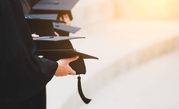 istock Close up Graduate holding a hat. Concept sucess education in University. 1058214524