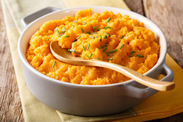 istock Vegetarian food: mashed sweet potatoes with herbs close-up on a table. horizontal 1058225176