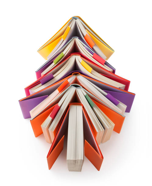 istock Christmas tree made out of books with bookmarks on white background 1058229690