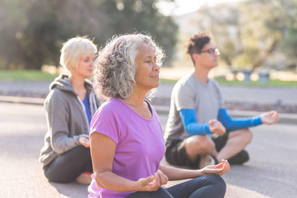 istock Co-ed group exercising together outside in the morning 1058232878