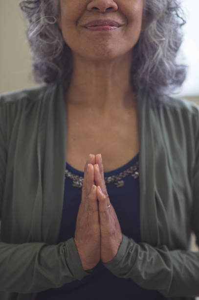 istock Senior ethnic woman practicing yoga 1058234334
