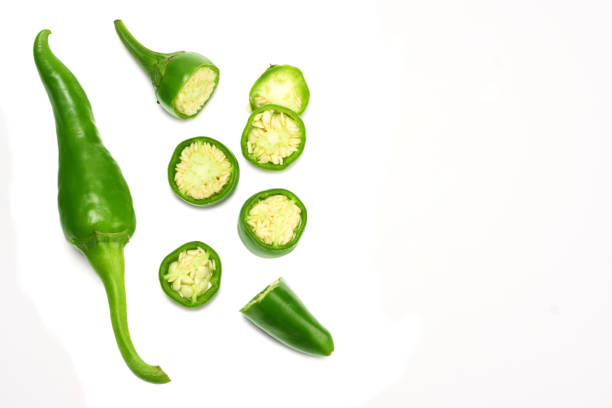 istock sliced green hot chili peppers isolated on white background top view 1058236518