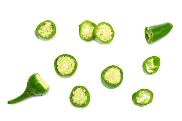 istock sliced green hot chili peppers isolated on white background top view 1058236546