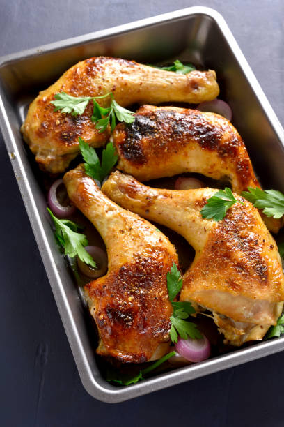 istock Grilled chicken legs in baking tray 1058236866