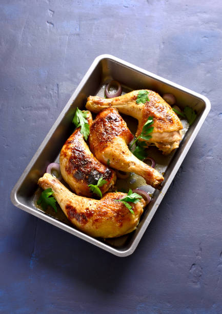 istock Grilled chicken legs in baking tray 1058236888