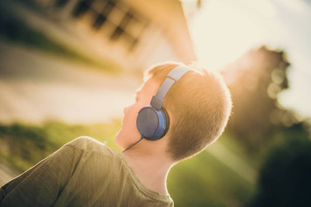 istock Boy in headphones in sunshine 1058241440