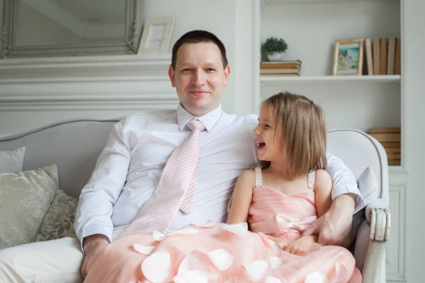 Dad and daughter having fun at home