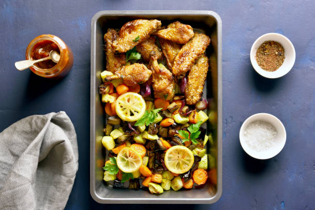 istock Grilled vegetables with chicken wings 1058242654