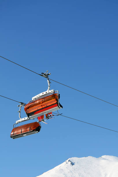 istock Mountains in winter with ski lift 1058244220