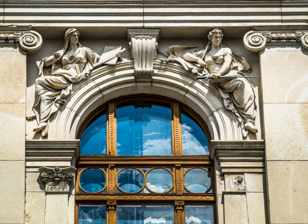 istock Old architectural building details with different statues and old window 1058244380