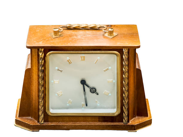 istock Old, vintage, wooden clock isolated on white background 1058247686