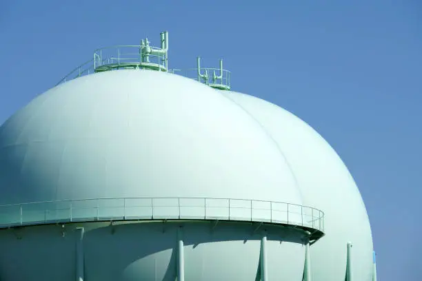 Sphere gas tanks in petrochemical plant against the blue sky