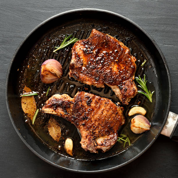 istock Grilled pork steak in frying pan 1058259124