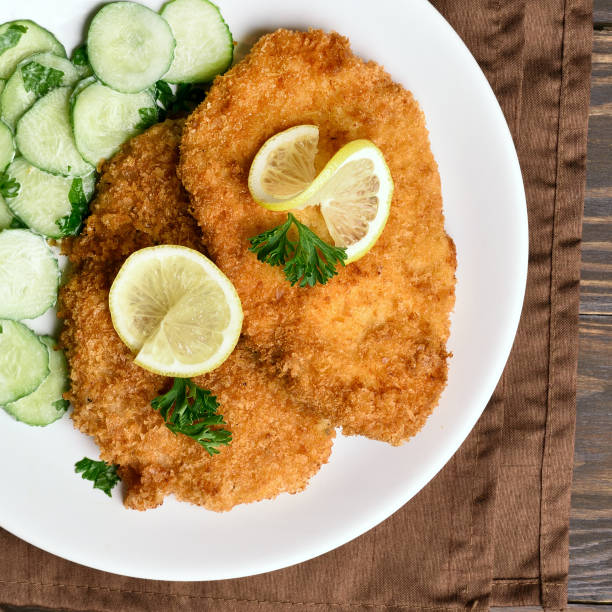 istock Schnitzel and cucumber salad 1058259298