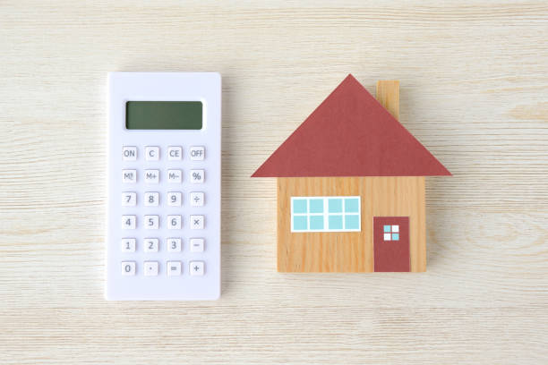 Calculator and house toy Calculator and house toy audition photos stock pictures, royalty-free photos & images