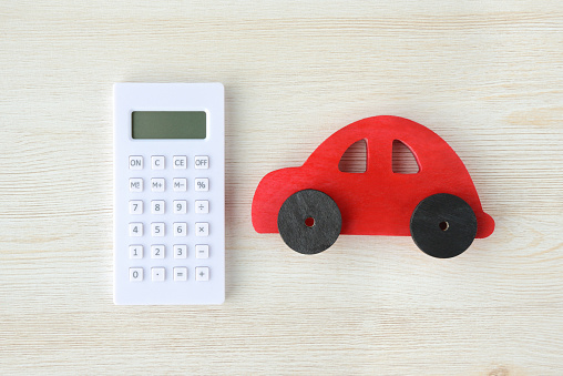 Calculator and red car toy