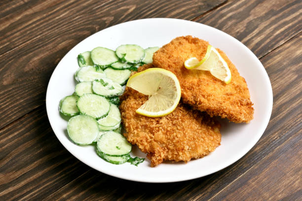 istock Schnitzel and cucumber salad 1058259380