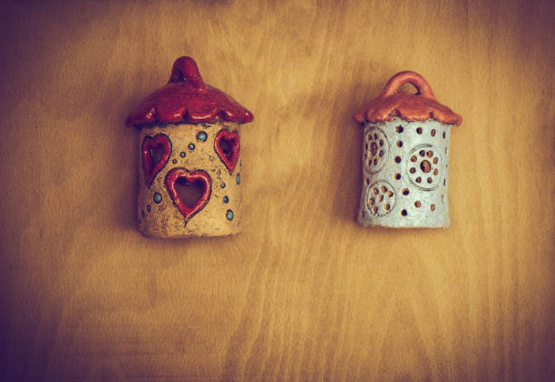 Wooden bird house with little round holes