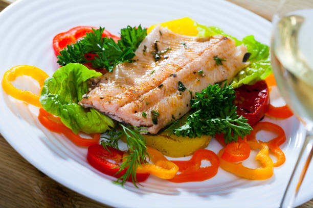 istock Roasted trout fillet with vegetables 1058265726