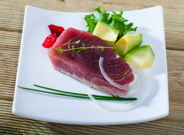 istock Light roasted tuna served with avocado 1058265814