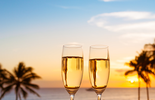 Champagne at the beach during sunset.