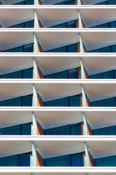 istock Rows of balconies in modern white apartment building 1058268388