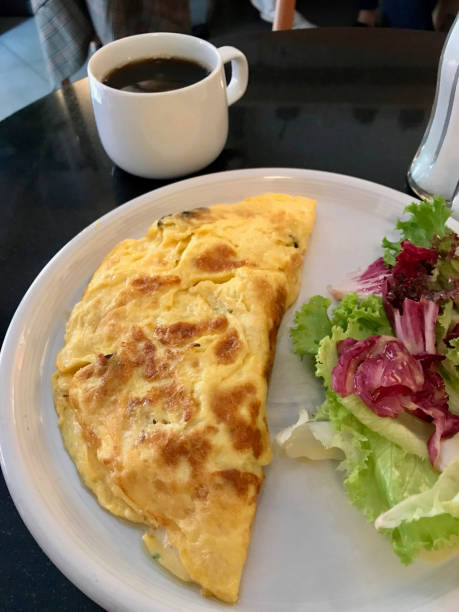 istock Omelette served with Fresh Salad and Coffee for Breakfast at Restaurant. 1058273078