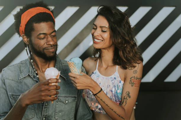 istock Cheerful couple enjoying ice cream 1058273764
