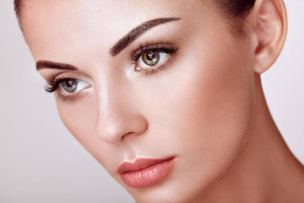 istock Beautiful woman with long false eyelashes 1058276868