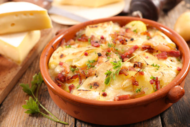 istock tartiflette, baked potato, bacon and cheese 1058277774
